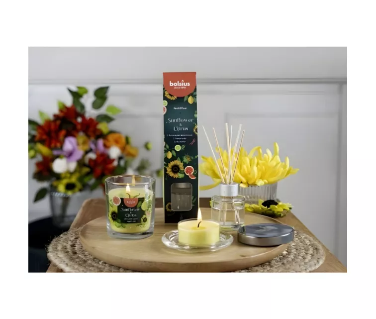 Aromatinė žvakė. Stiklinė. „Floral Fusion“ Ø80x72mm. Saulėgrąžų ir citrusinių vaisių.